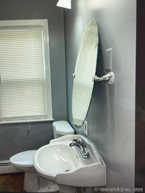 555 Frost Road Waterbury, CT 06705 - Photo 8 of 11 a bathroom with a sink mirror and toilet
