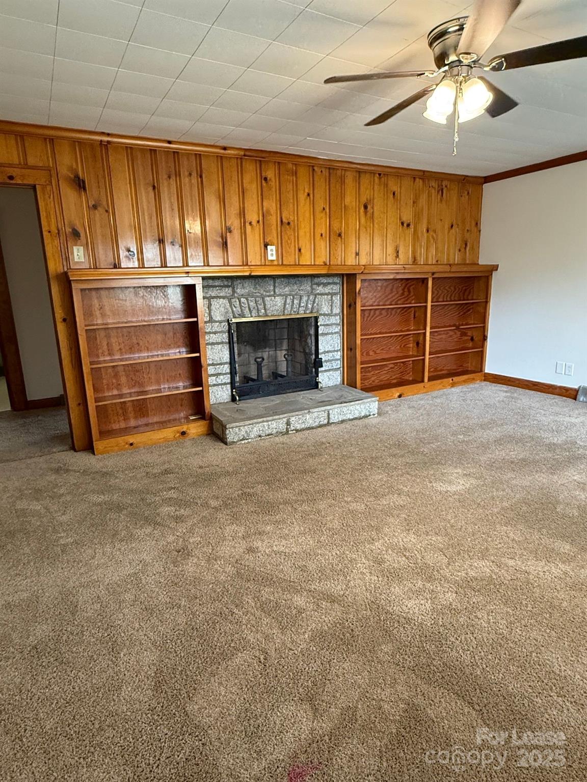 225 J J Brown Road Salisbury, NC 28146 - Photo 3 of 17 a view of an empty room with a fireplace