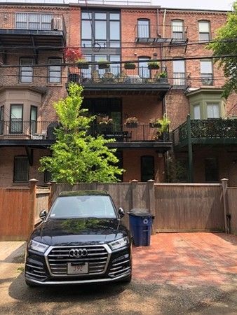 a car parked in front of a building