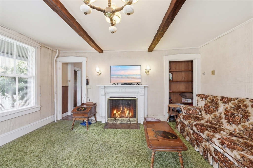 16 Main Street Brookfield, MA 01506 - Photo 12 of 45 a living room with furniture and a fireplace