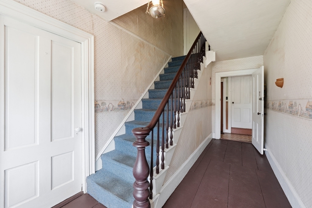 16 Main Street Brookfield, MA 01506 - Photo 16 of 45 a view of a hallway with wooden floor and entryway