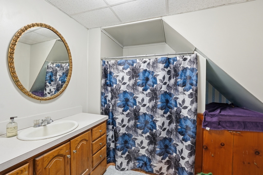 16 Main Street Brookfield, MA 01506 - Photo 17 of 45 a bathroom with a sink and a mirror
