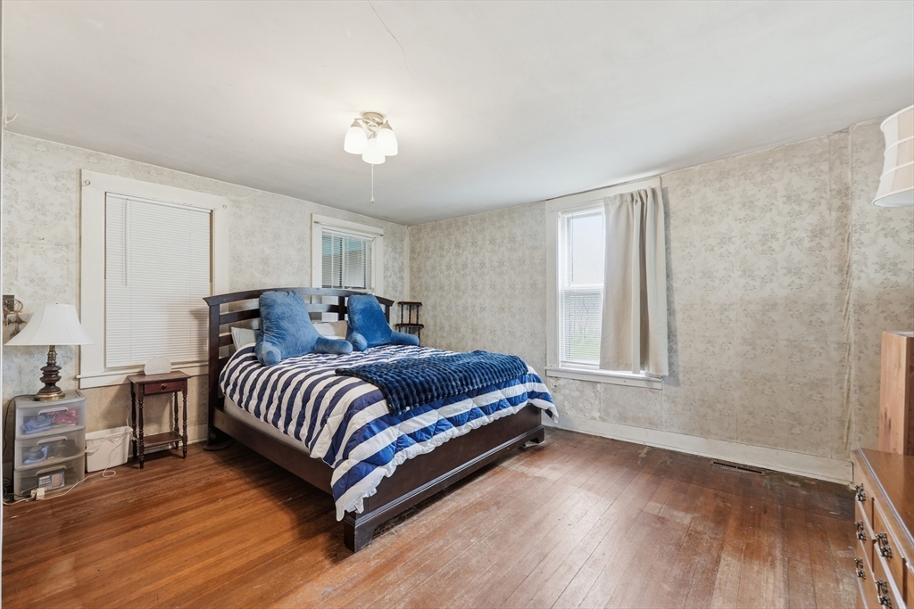 16 Main Street Brookfield, MA 01506 - Photo 18 of 45 a spacious bedroom with a bed and a window