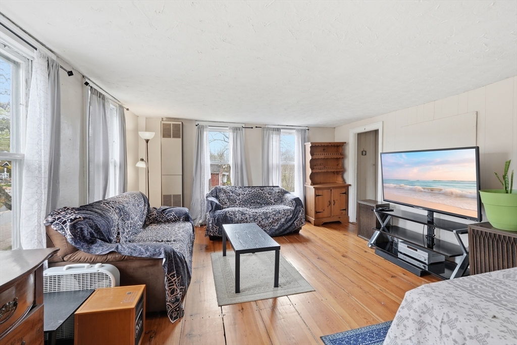 16 Main Street Brookfield, MA 01506 - Photo 22 of 45 a living room with furniture and a flat screen tv