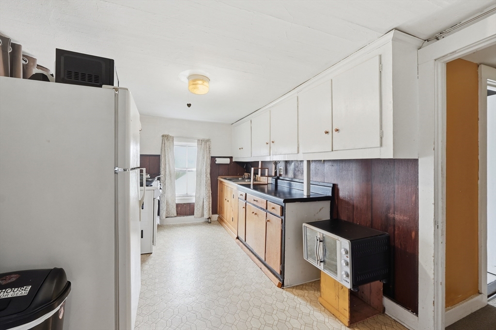 16 Main Street Brookfield, MA 01506 - Photo 24 of 45 a kitchen with stainless steel appliances a refrigerator and a stove