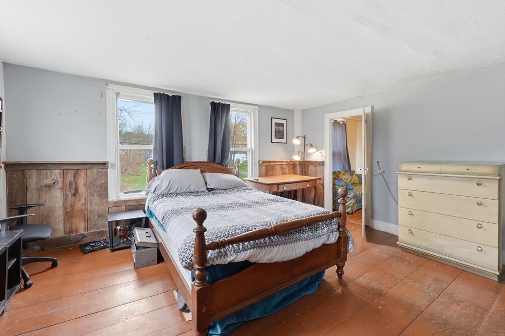 16 Main Street Brookfield, MA 01506 - Photo 28 of 45 a bedroom with a bed and a dresser in it