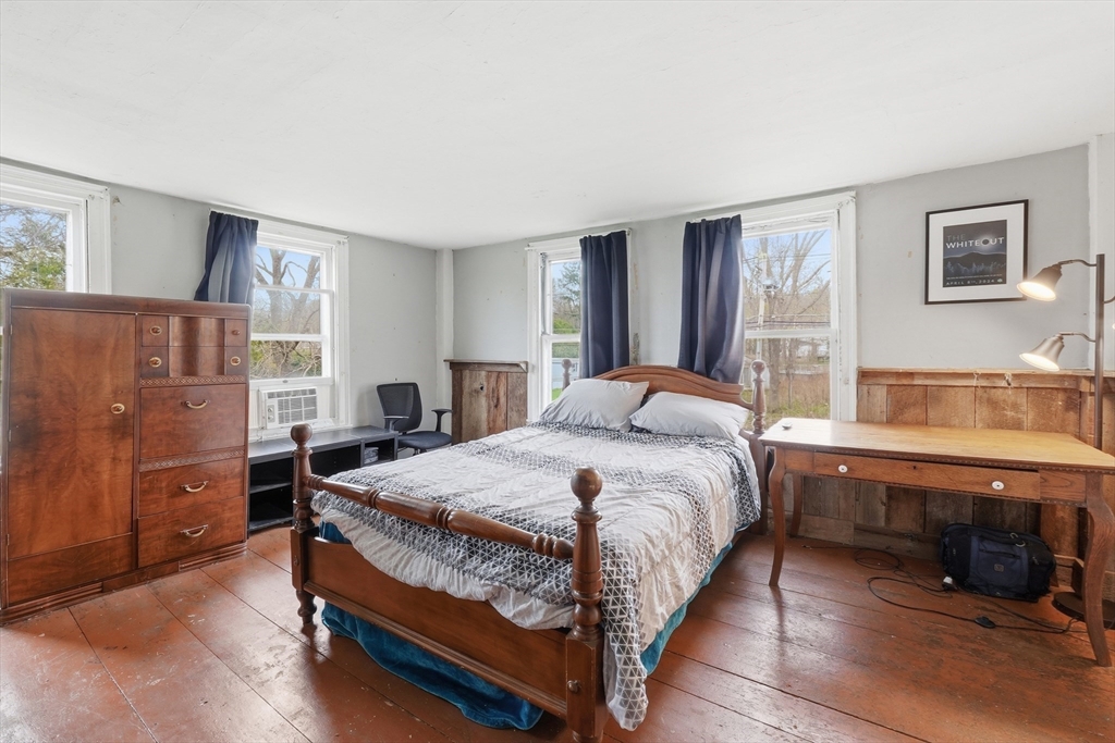 16 Main Street Brookfield, MA 01506 - Photo 29 of 45 a bedroom with a bed and a table