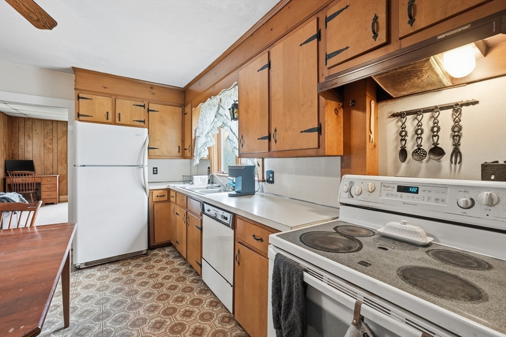 16 Main Street Brookfield, MA 01506 - Photo 8 of 45 a kitchen with a stove a sink and a refrigerator