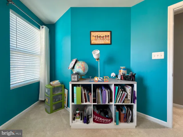 a bathroom with a sink mirror and vanity