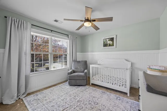 a bathroom with a sink a vanity a shower and a mirror