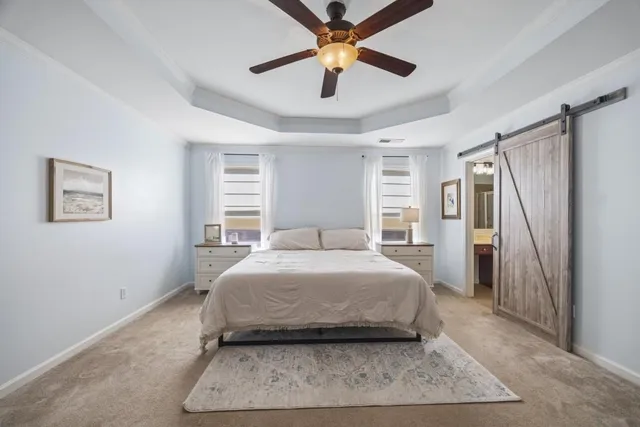 a spacious bathroom with a granite countertop double vanity sink a mirror and shower