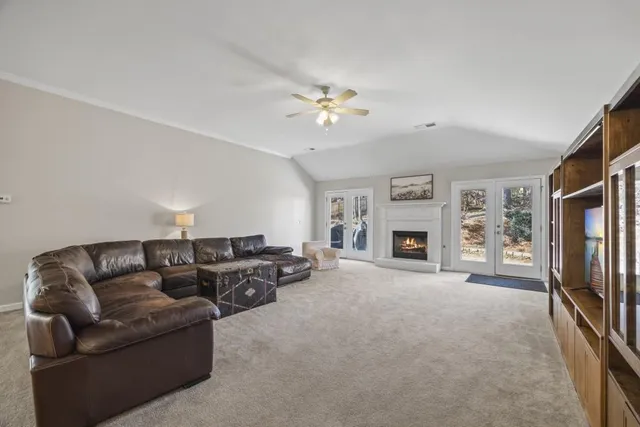 a view of a room with wooden floor