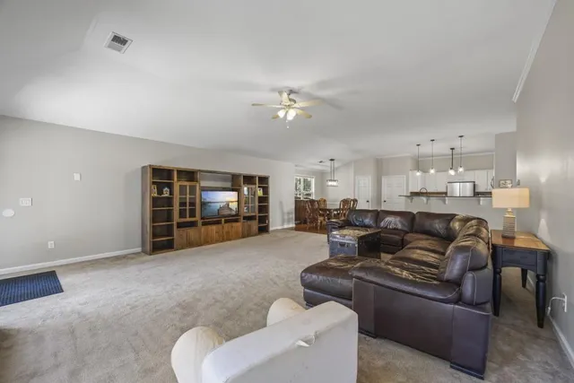 a kitchen with a sink stainless steel appliances and cabinets