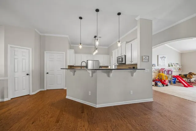 a view of a backyard with chairs