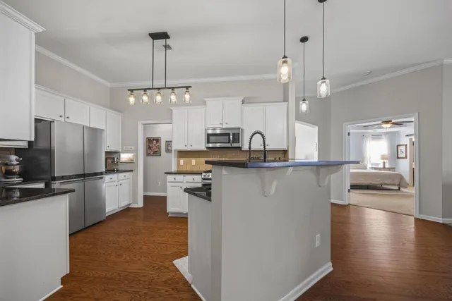 a view of a dinning table and chairs in patio