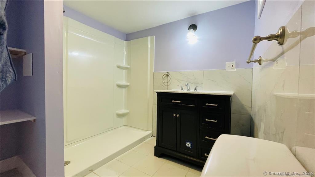 31 Brainerd Road Branford, CT 06405 - Photo 37 of 39 Basement studio full bathroom with tub-sized step-in shower