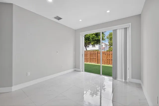 a bathroom with a sink toilet vanity and shower