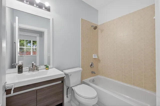 a bathroom with a bathtub and a toilet