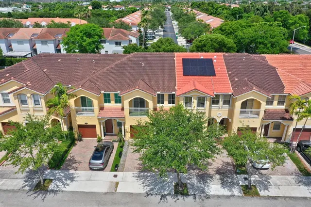 an aerial view of residential building and residential space with city view