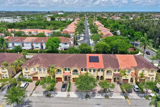 an aerial view of house with yard