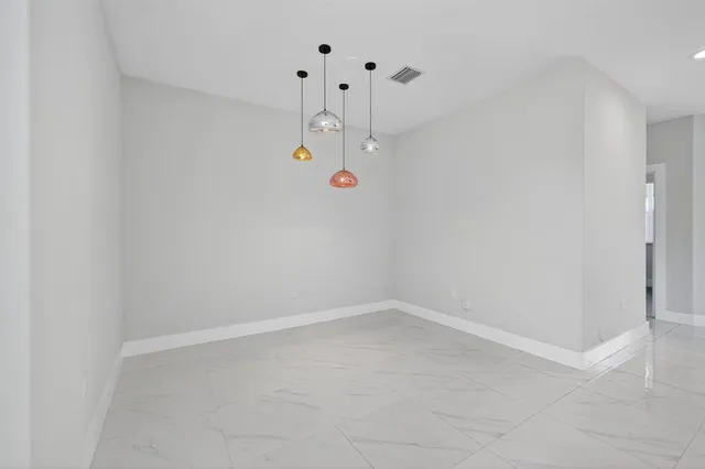 a bathroom with a sink and a large mirror