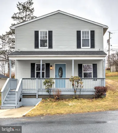 a front view of a house with swimming pool