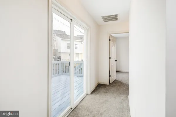 a view of a room with large windows