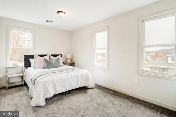 a bedroom with a bed and a walk in closet