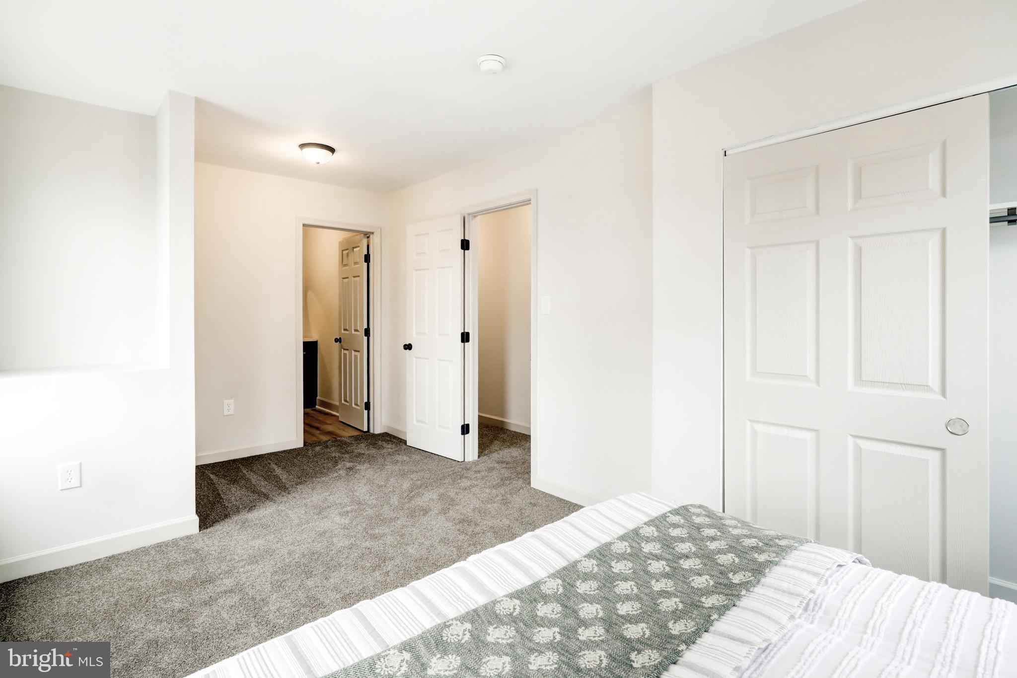 5 Edgewood Avenue Temple, PA 19560 - Photo 25 of 30 a bedroom with a bed and a walk in closet