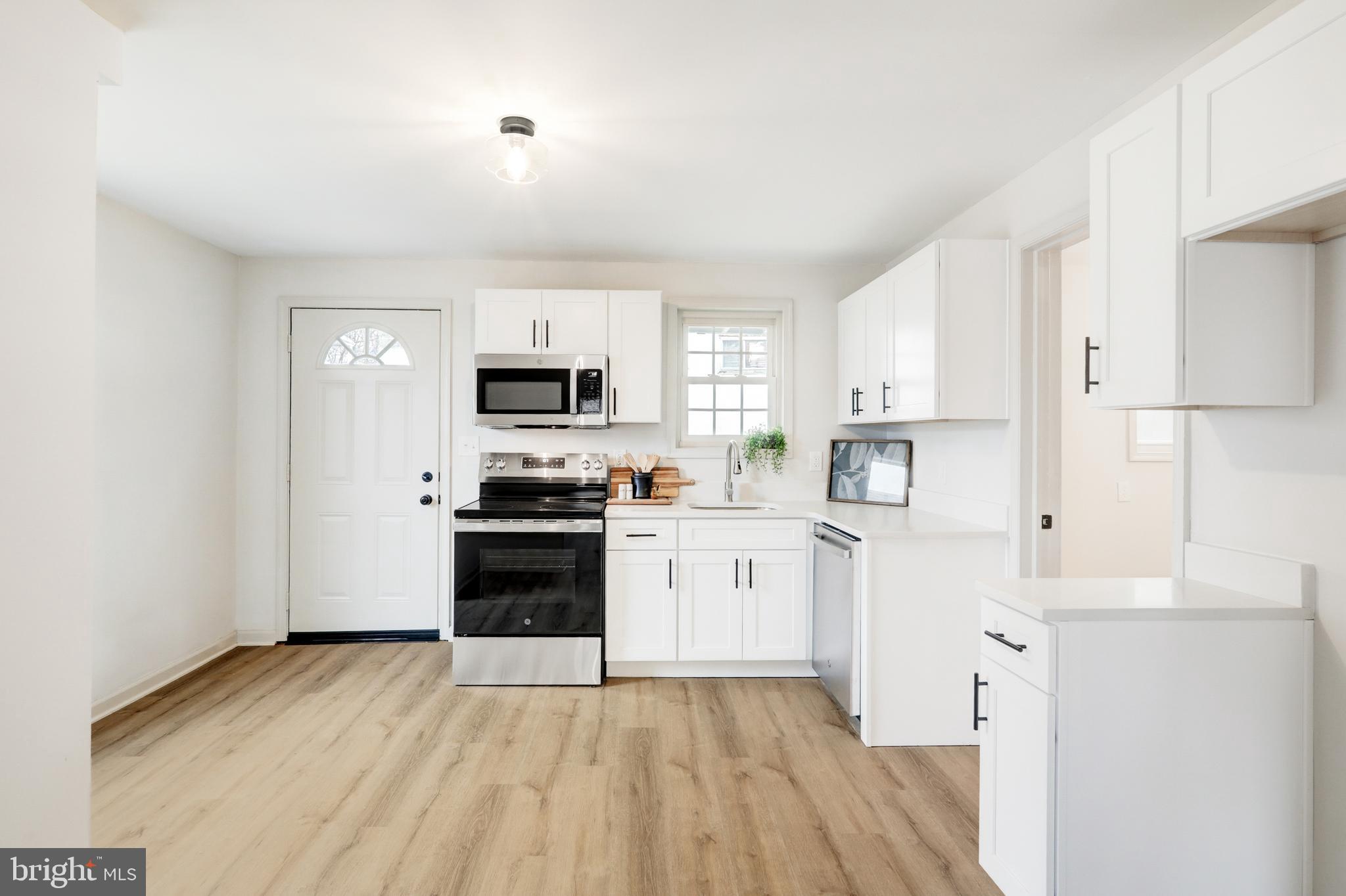 5 Edgewood Avenue Temple, PA 19560 - Photo 7 of 30 a kitchen with cabinets stainless steel appliances and a window