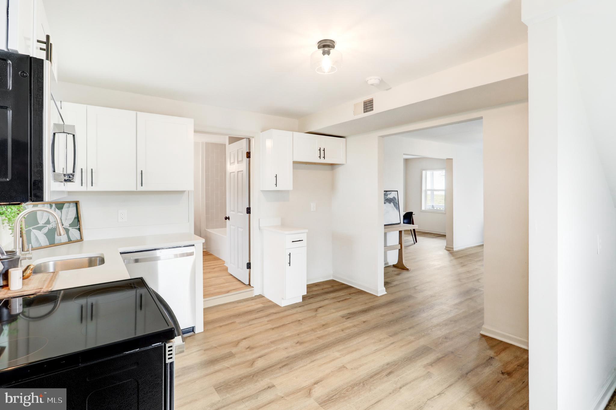 5 Edgewood Avenue Temple, PA 19560 - Photo 10 of 30 a kitchen with a refrigerator and a stove top oven