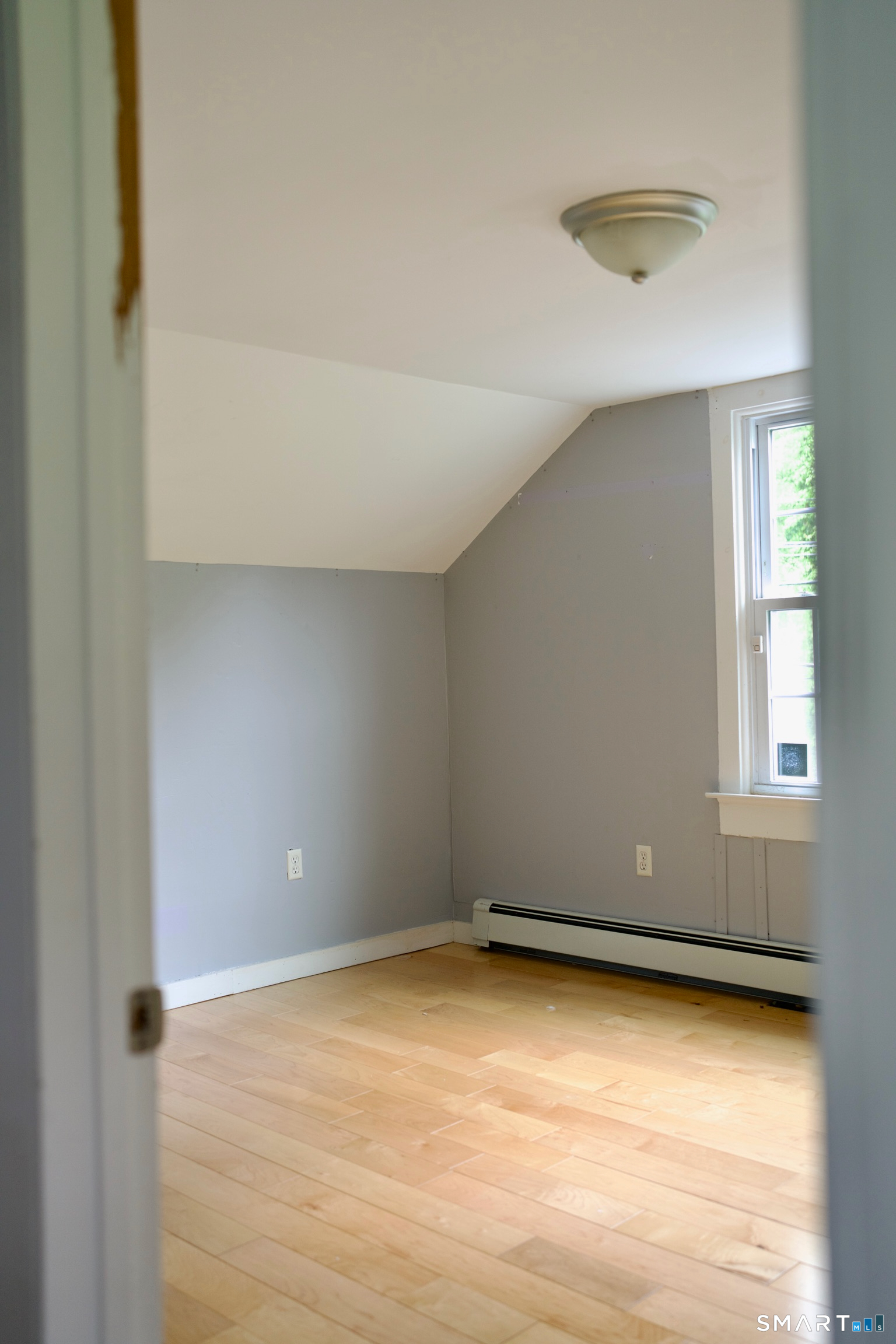 259 Peck Hill Road Woodbridge, CT 06525 - Photo 25 of 32 a view of an empty room with a window