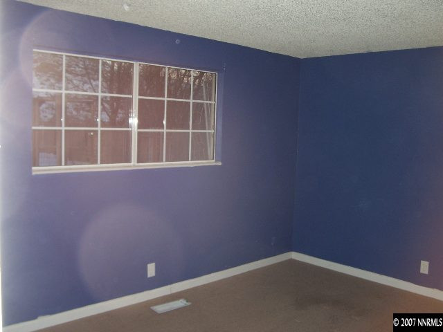 9210 Fremont Way Reno, NV 89506 - Photo 4 of 9 a view of an empty room with a window