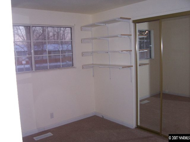 9210 Fremont Way Reno, NV 89506 - Photo 6 of 9 a view of walk in closet with empty racks