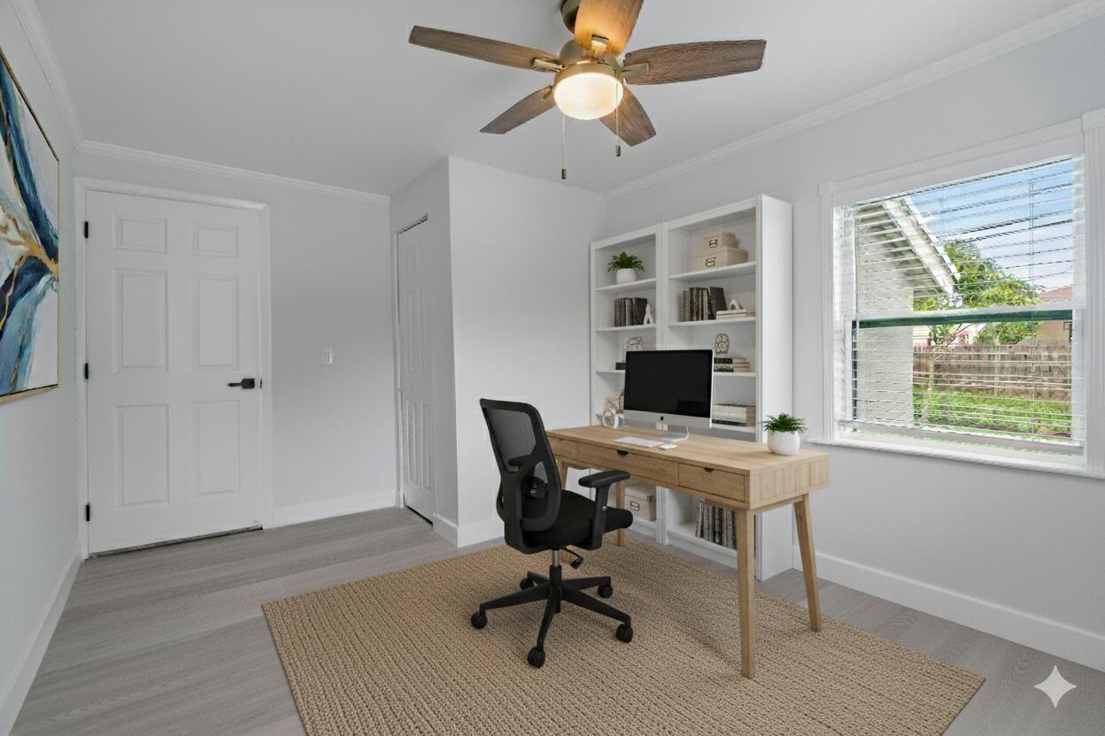 137 Southwest 9th Avenue Delray Beach, FL 33444 - Photo 17 of 26 a view of a workspace with furniture and a window