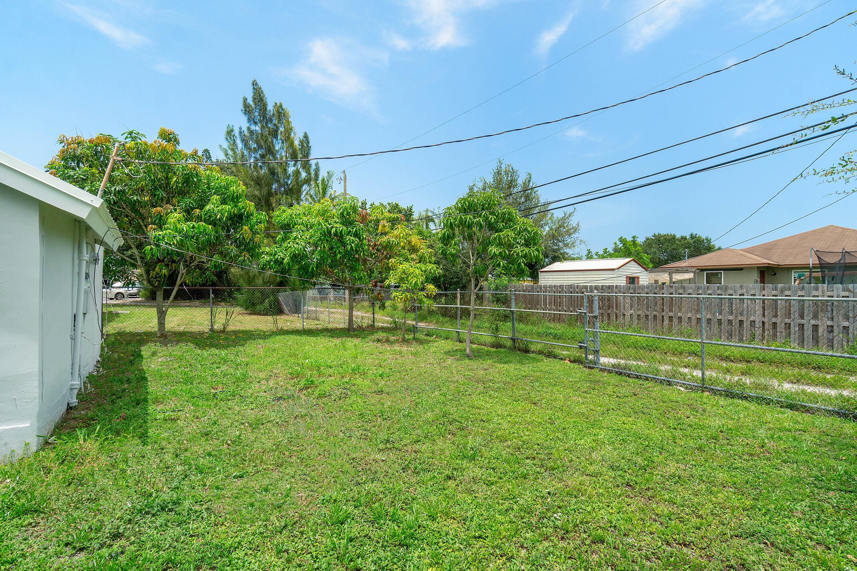 137 Southwest 9th Avenue Delray Beach, FL 33444 - Photo 24 of 26 a view of a house with a backyard