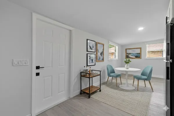 a view of a livingroom with furniture and wooden floor