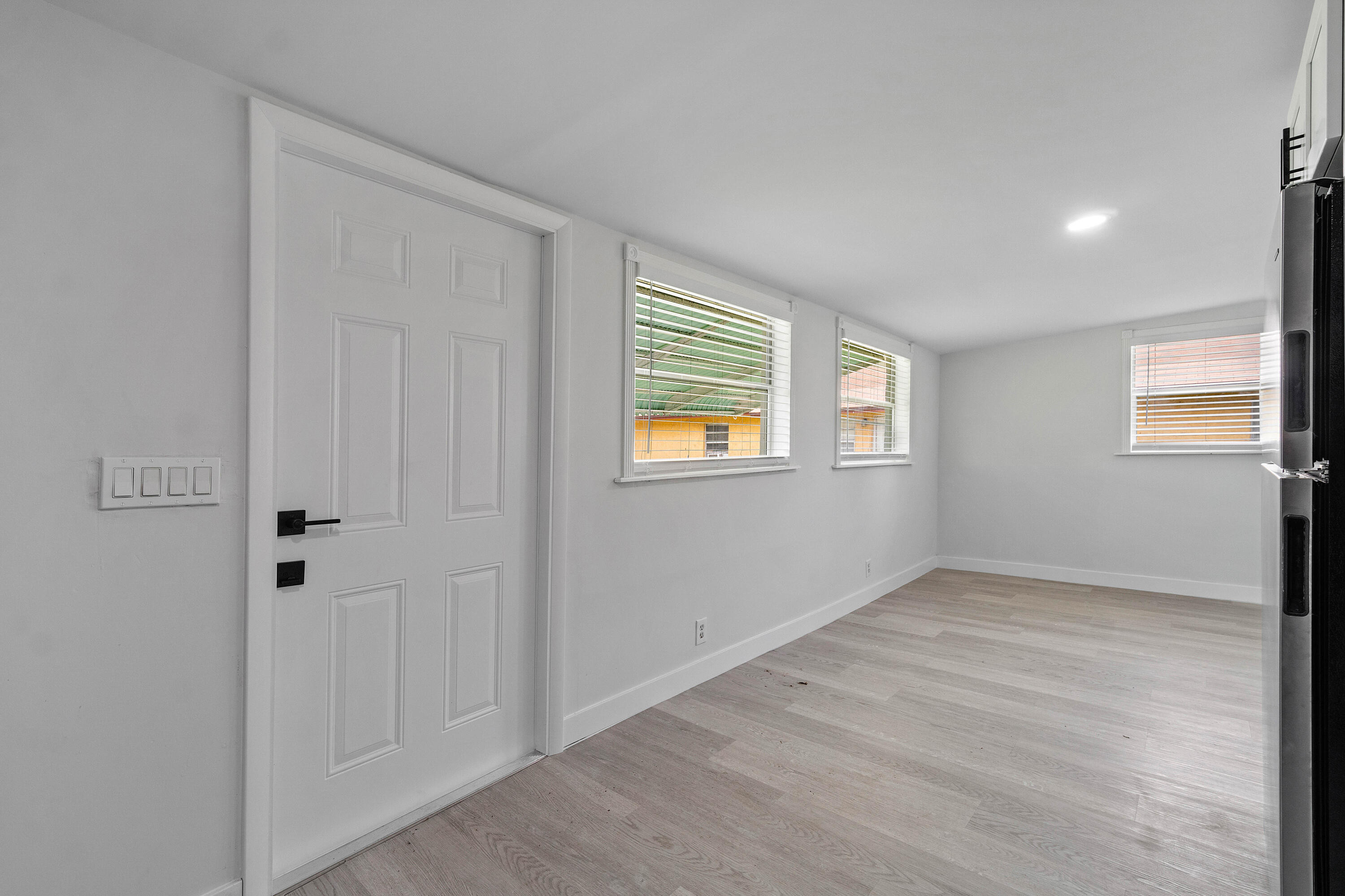 137 Southwest 9th Avenue Delray Beach, FL 33444 - Photo 6 of 26 a view of an empty room with a window