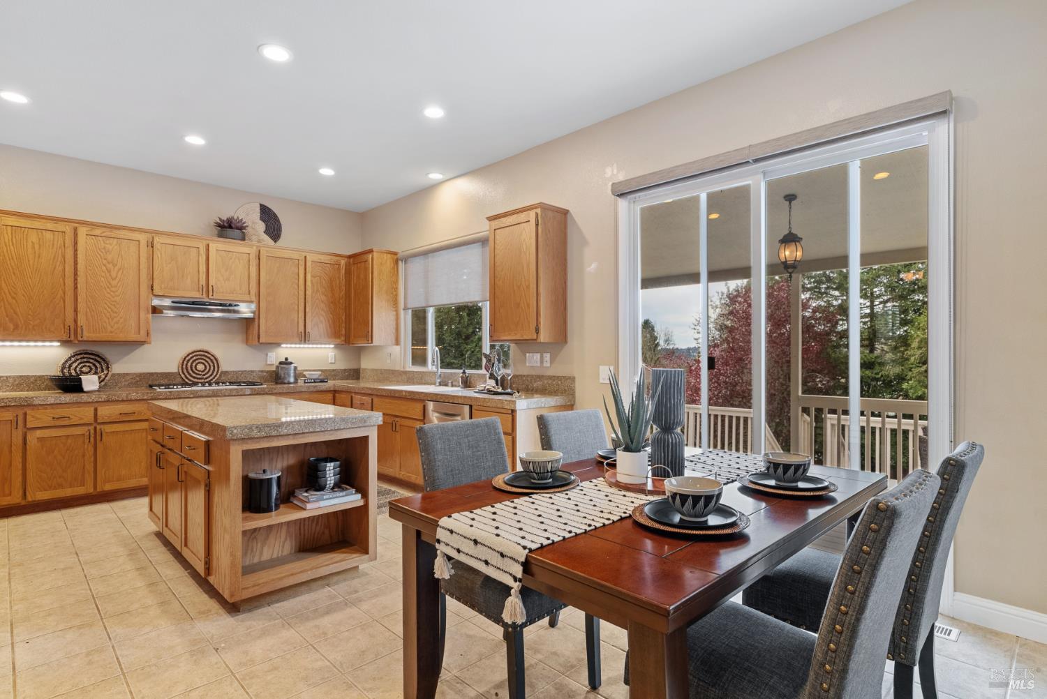 5783 Owl Light Terrace Santa Rosa, CA 95409 - Photo 13 of 51 a view of kitchen with kitchen island stainless steel appliances sink stove dining table and chairs