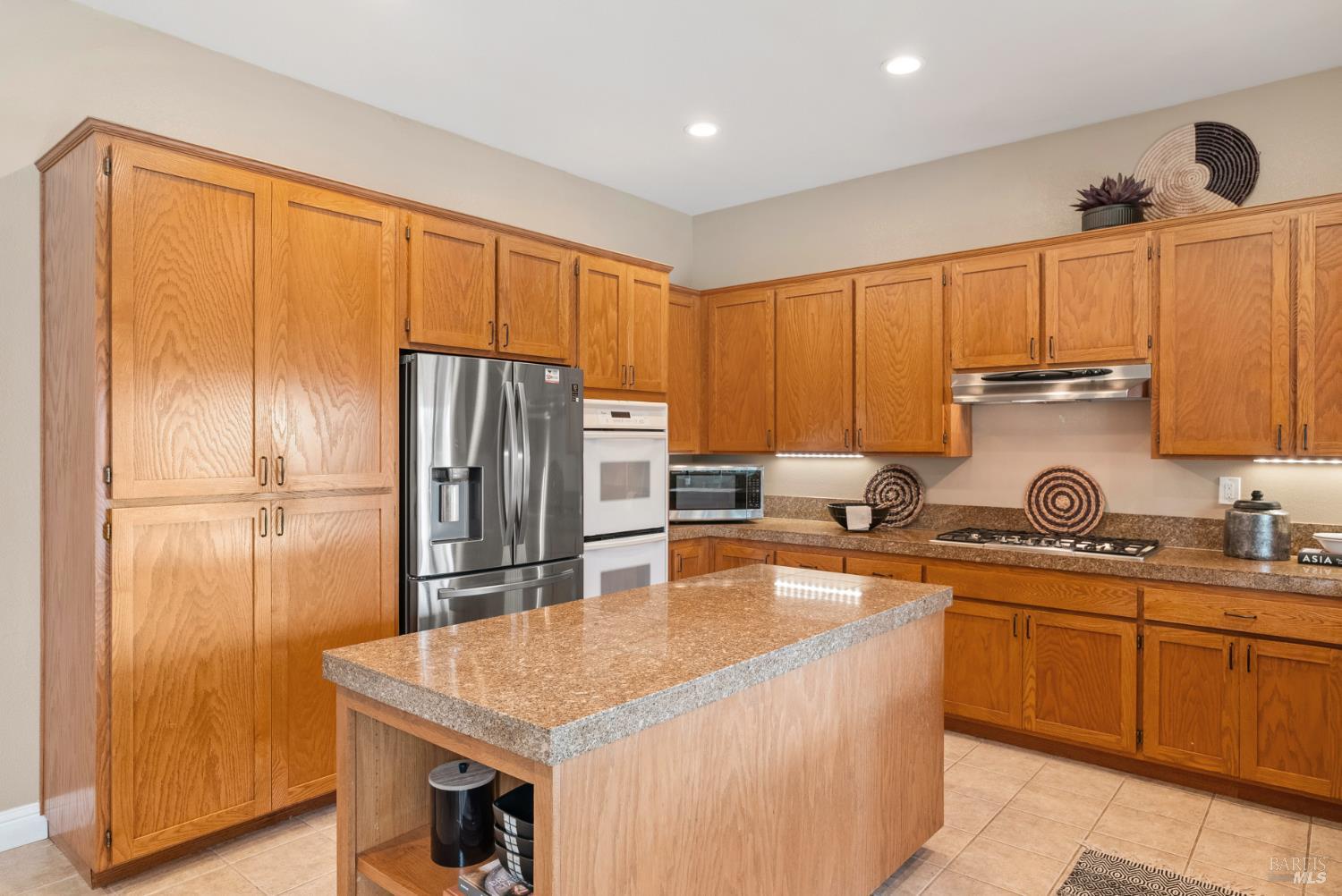 5783 Owl Light Terrace Santa Rosa, CA 95409 - Photo 16 of 51 a kitchen with stainless steel appliances granite countertop a sink a stove and refrigerator