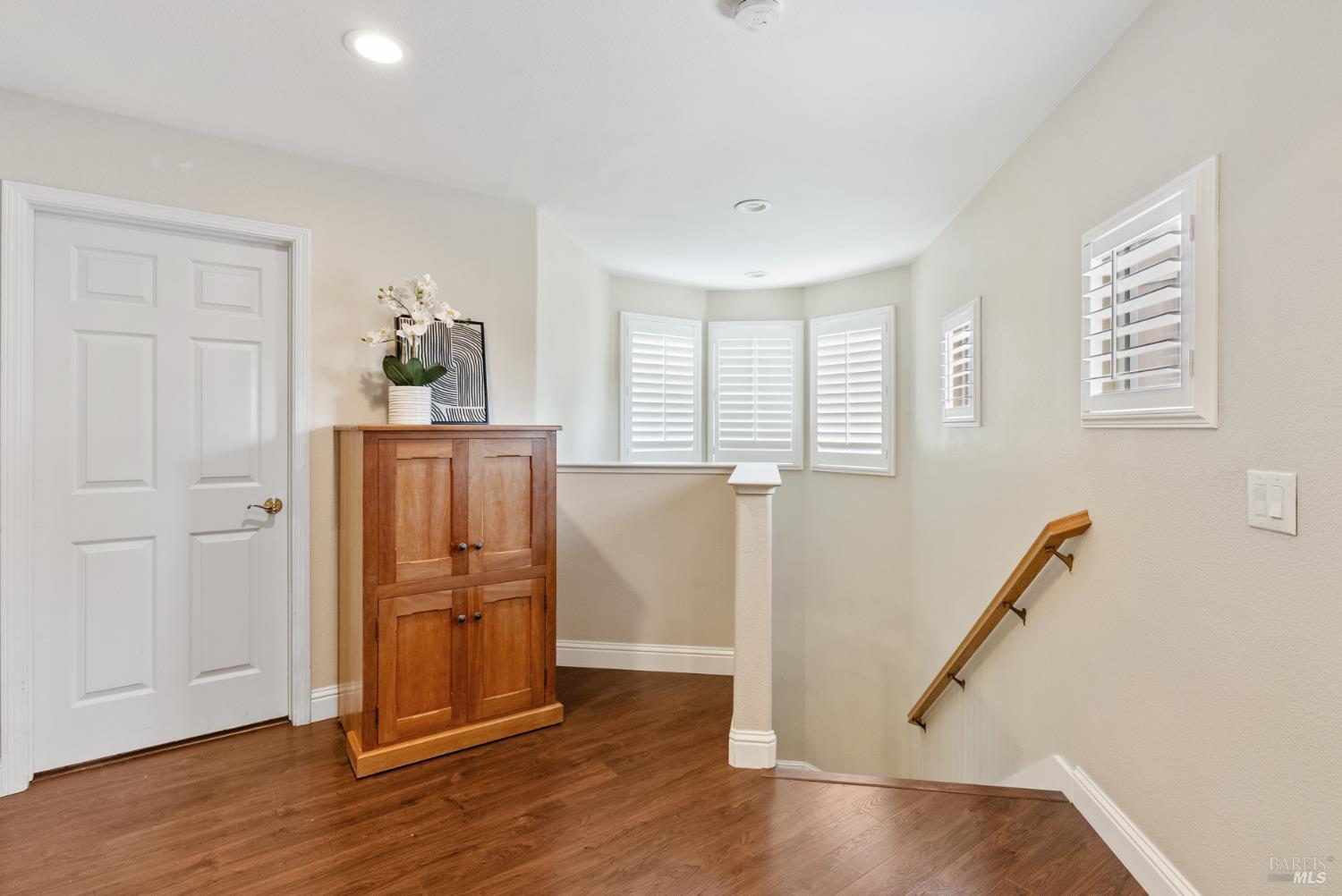 5783 Owl Light Terrace Santa Rosa, CA 95409 - Photo 31 of 51 a view of a livingroom with wooden floor and staircase