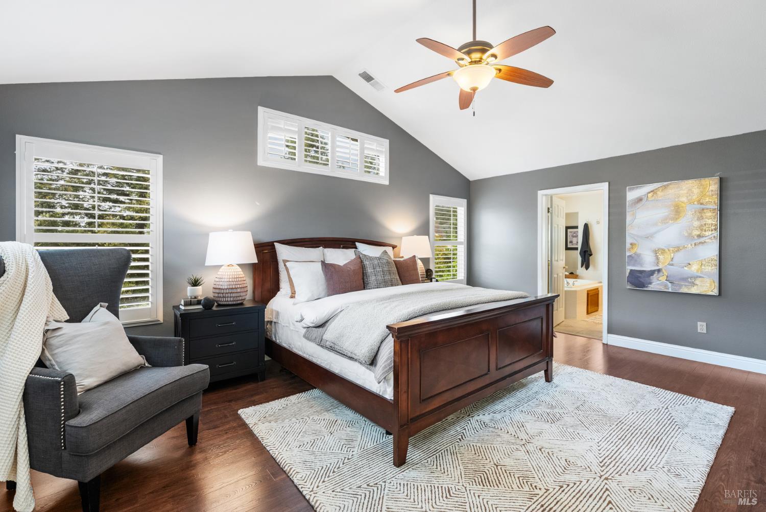 5783 Owl Light Terrace Santa Rosa, CA 95409 - Photo 33 of 51 a bedroom with a bed and wooden floor