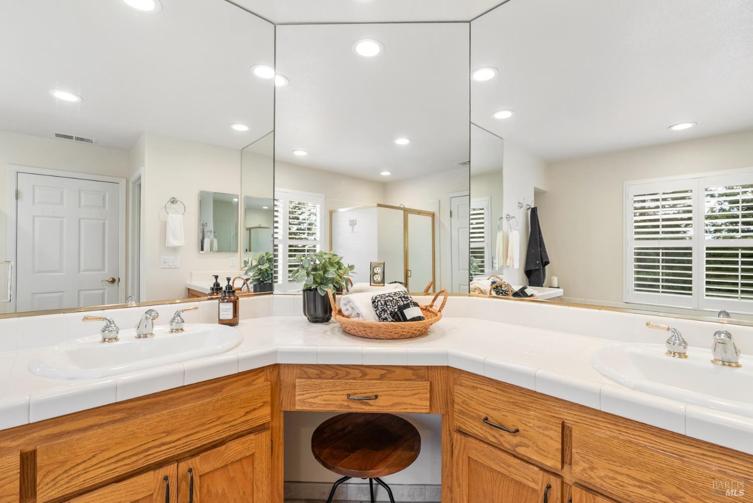 5783 Owl Light Terrace Santa Rosa, CA 95409 - Photo 37 of 51 a bathroom with a sink a large mirror and a window