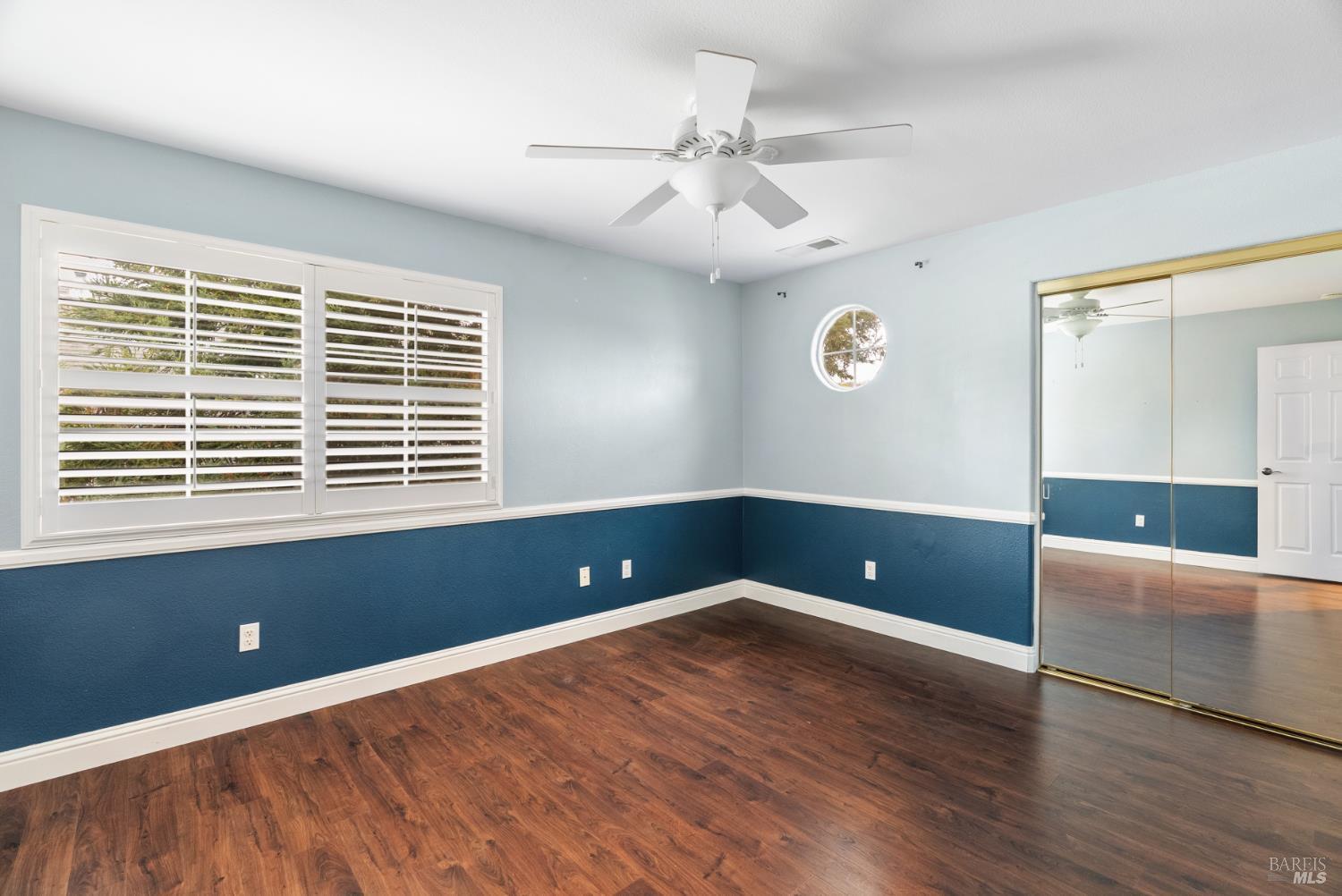 5783 Owl Light Terrace Santa Rosa, CA 95409 - Photo 42 of 51 an empty room with wooden floor and windows