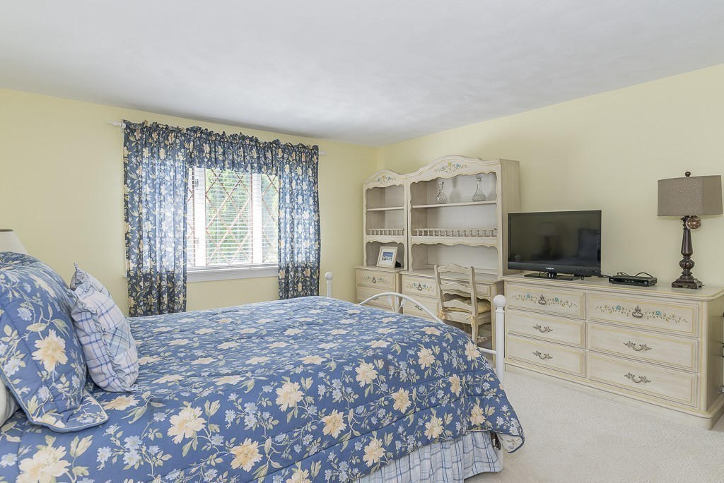 26 Meadow Road Beverly, MA 01915 - Photo 16 of 20 a spacious bedroom with a bed and a flat screen tv