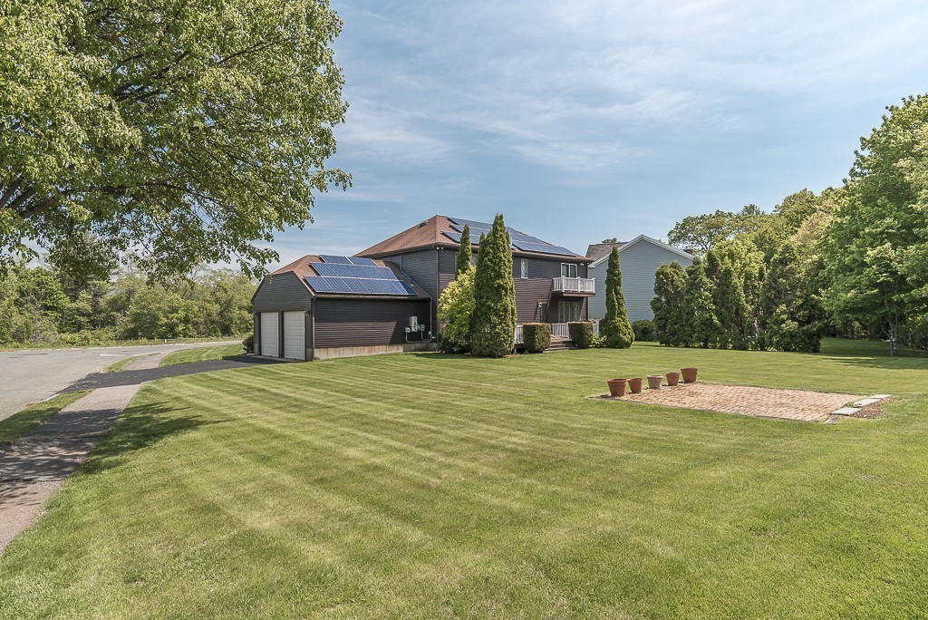 26 Meadow Road Beverly, MA 01915 - Photo 3 of 20 a front view of a house with a yard