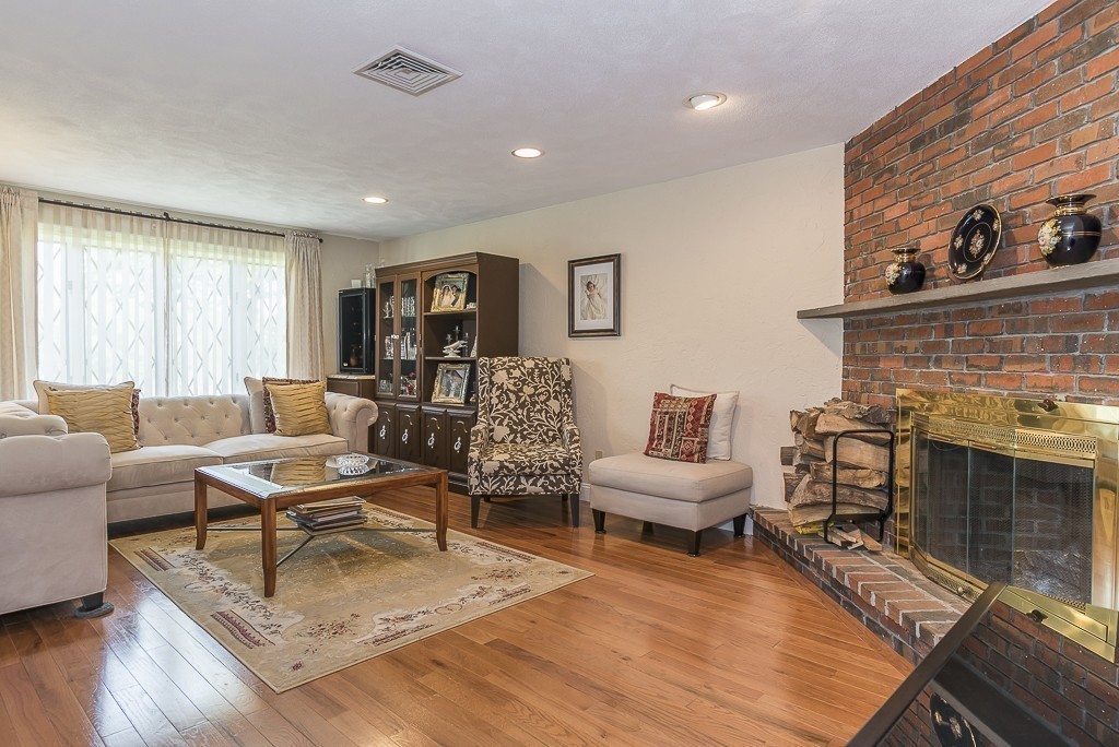 26 Meadow Road Beverly, MA 01915 - Photo 4 of 20 a living room with furniture and a fireplace