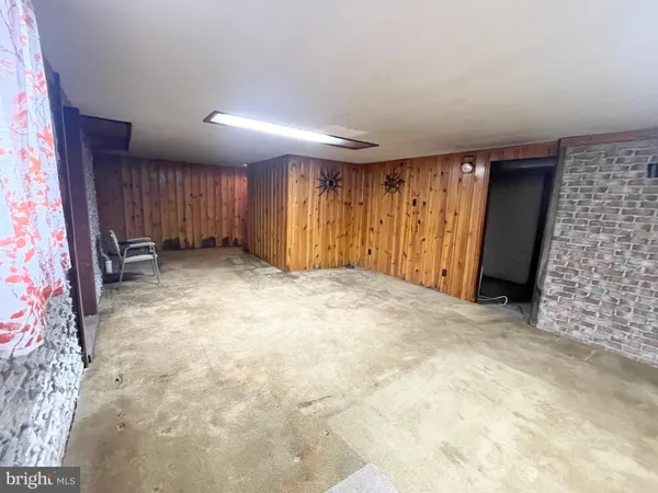 a view of an empty room with a fireplace