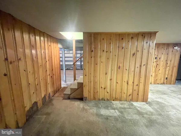 a view of a room with a wooden door