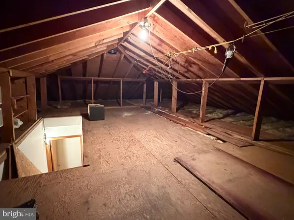 a view of a backyard with seating space